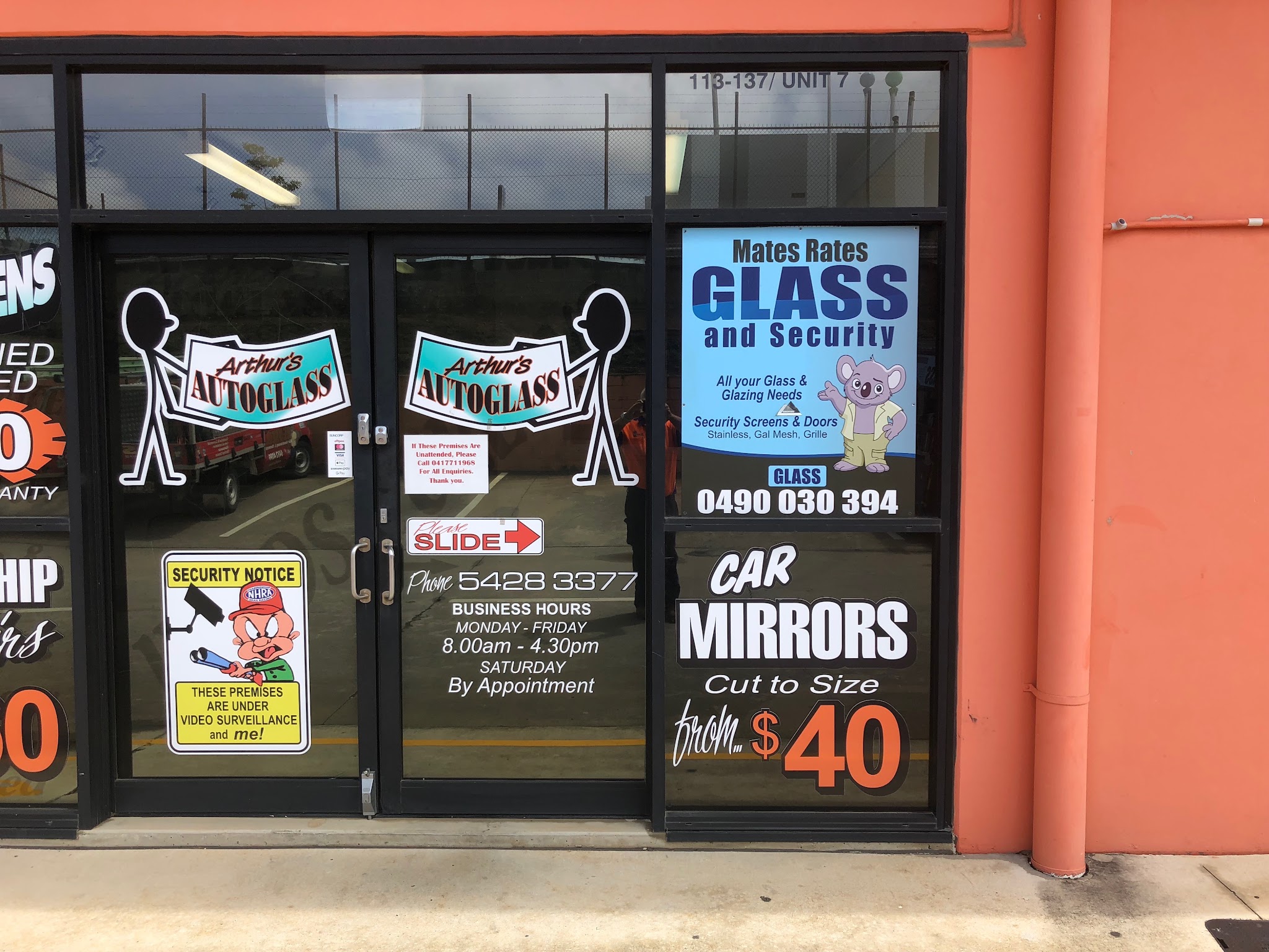 Mates Rates Glass and Security sign in the shopfront window at Unit 7, 113-137 Morayfield Road